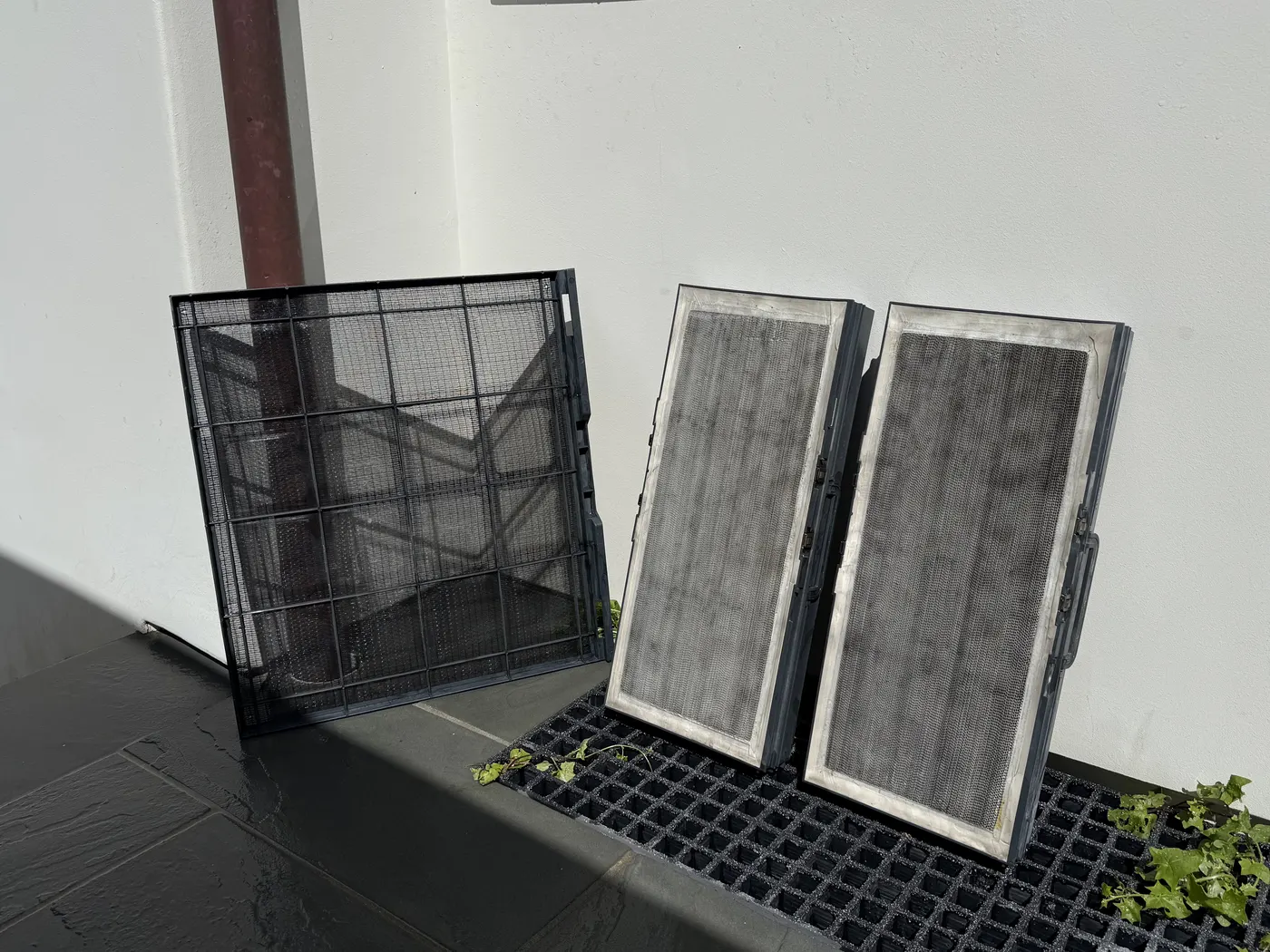 The same three air filters after service, with the dust cleared.