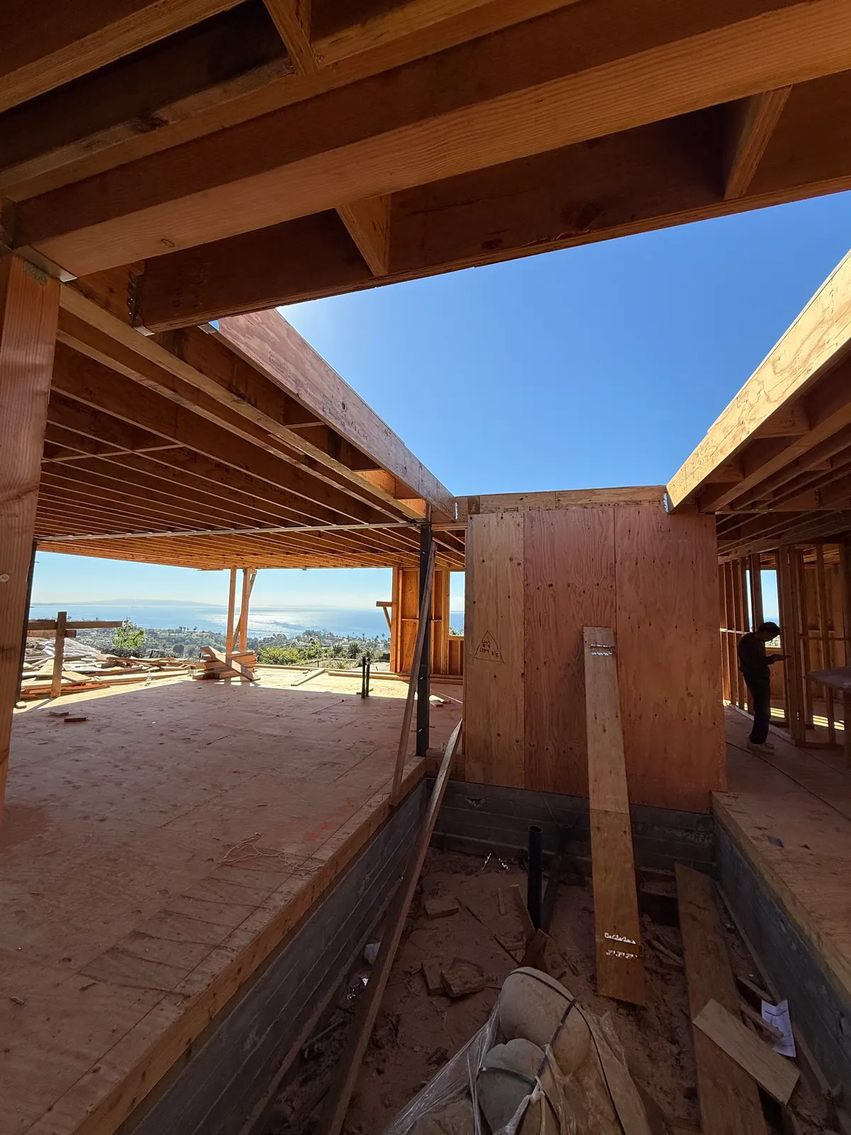 Wood framing with an open wall and a view beyond, before finishes.