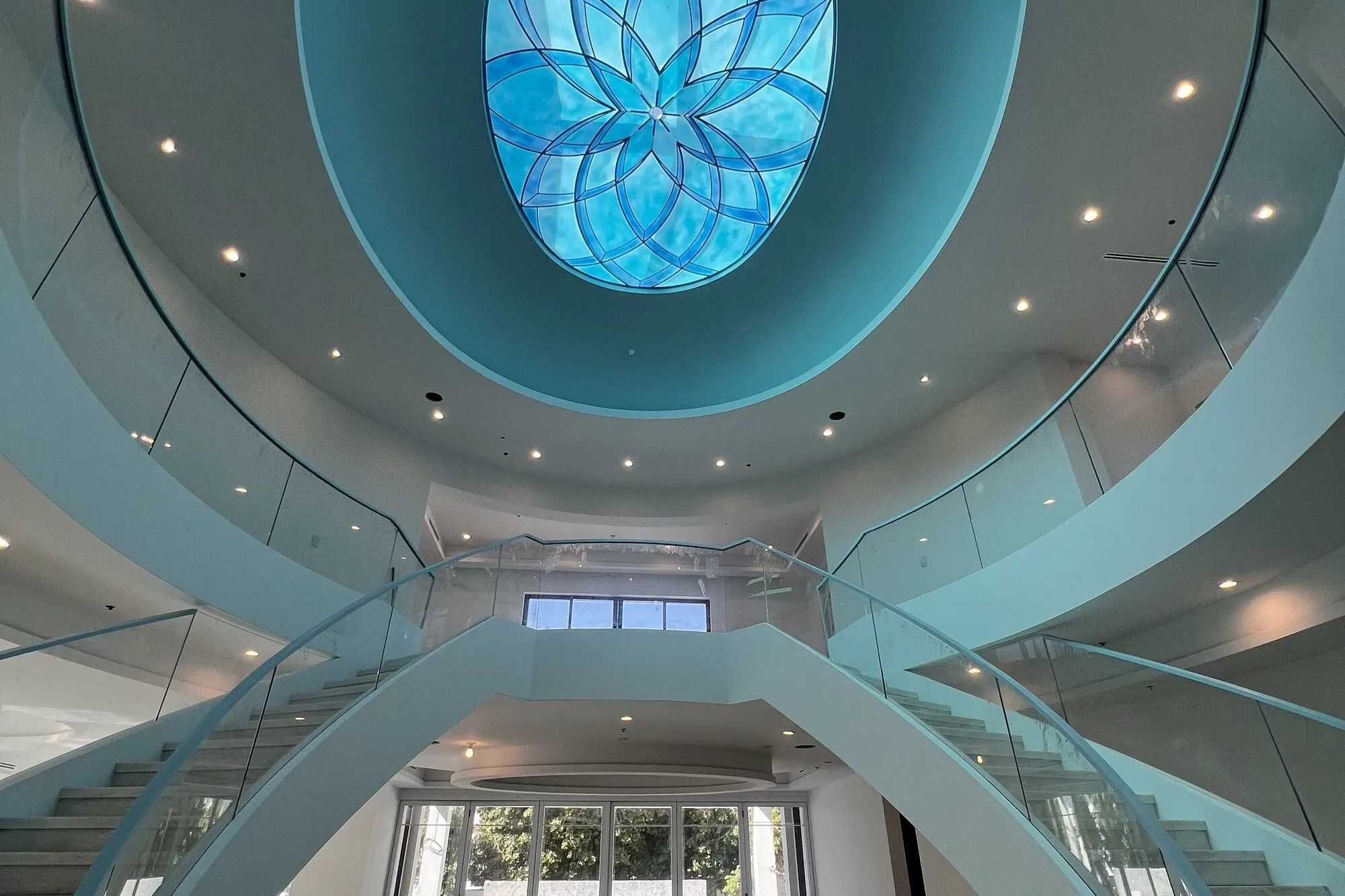 Beverly Hills stair hall with a blue glass skylight