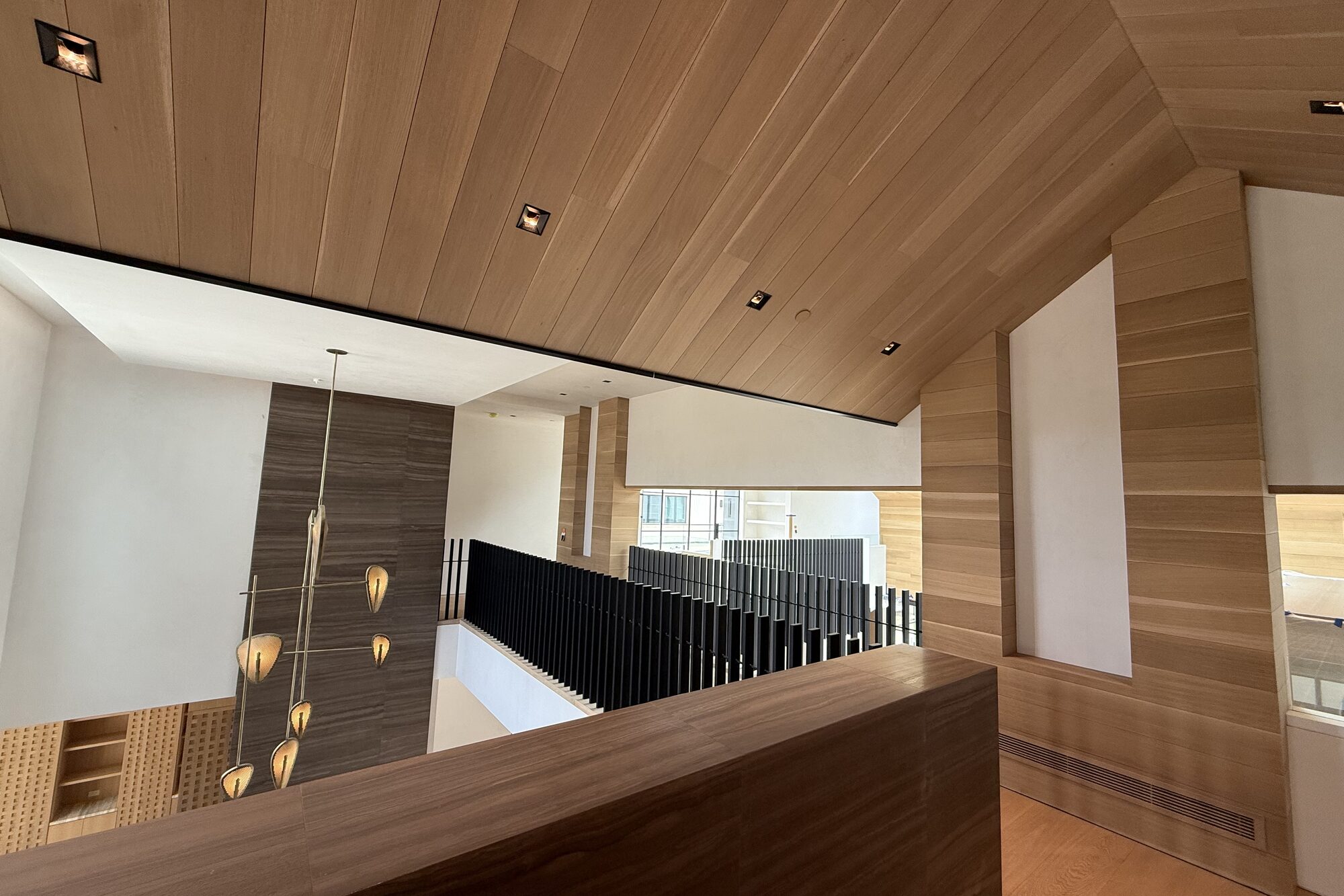 Wood ceiling and a double-height room.