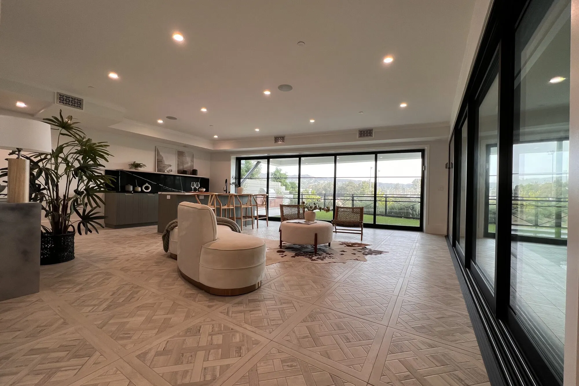 Living room with glass doors and a view in Pacific Palisades.
